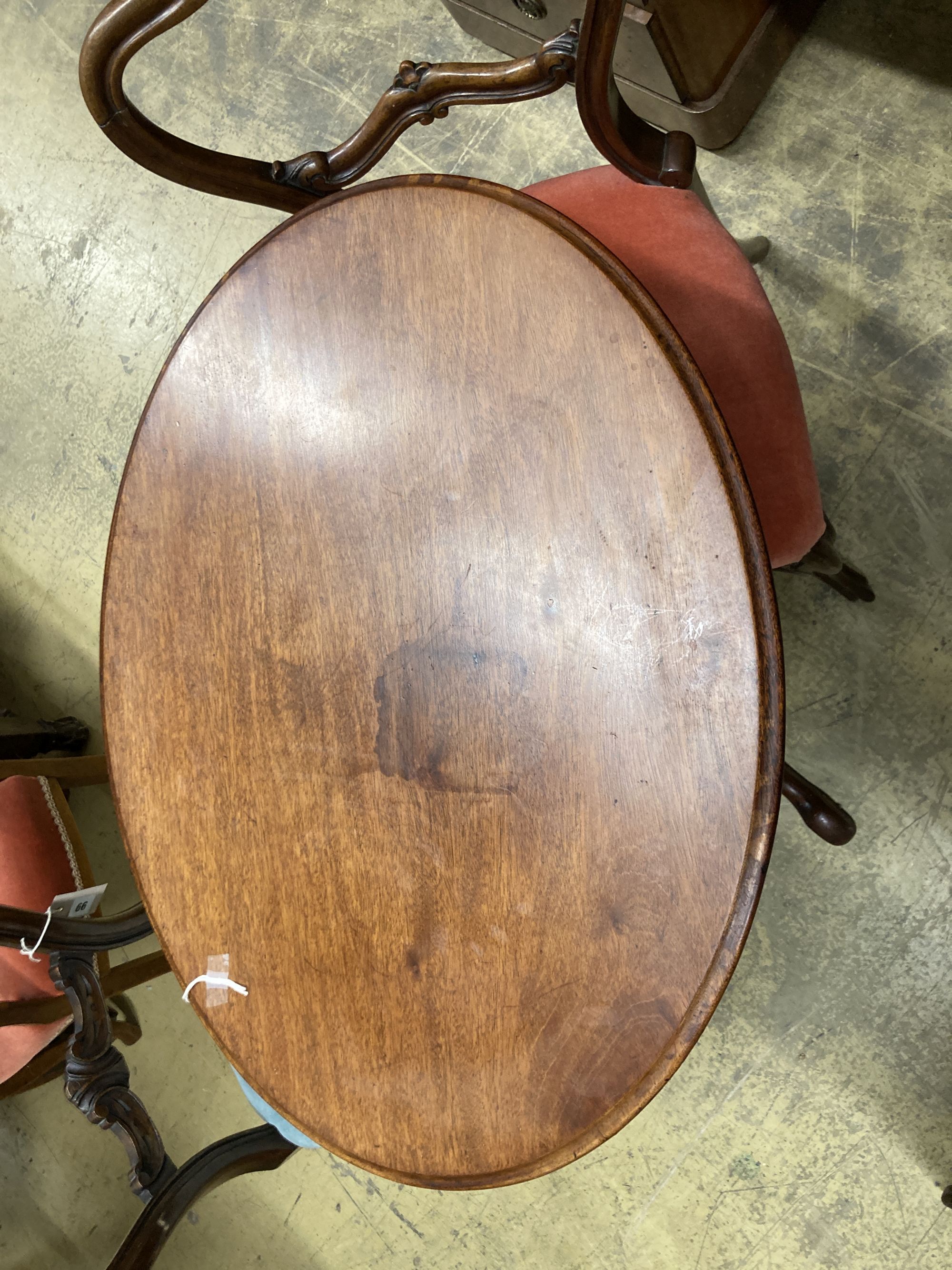 A Victorian oval tripod table, width 68cm, depth 52cm, height 72cm together with four Victorian spoon back dining chairs (three plus one)